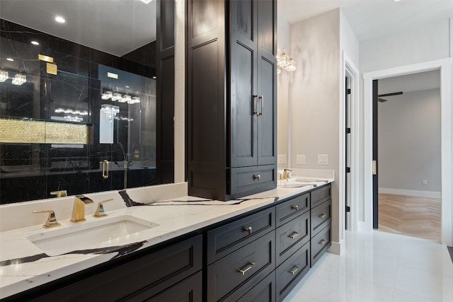 bathroom featuring walk in shower and vanity