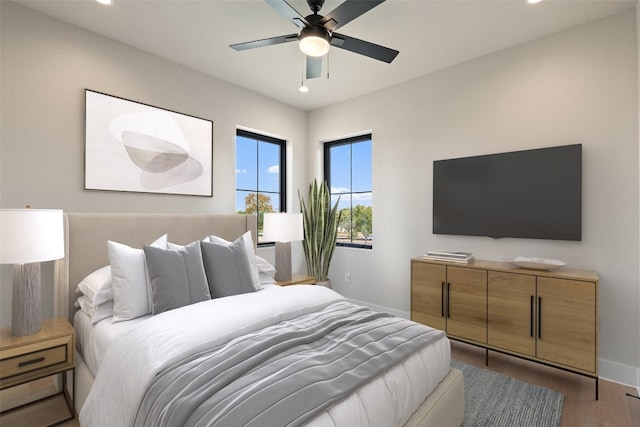 bedroom featuring light hardwood / wood-style flooring and ceiling fan