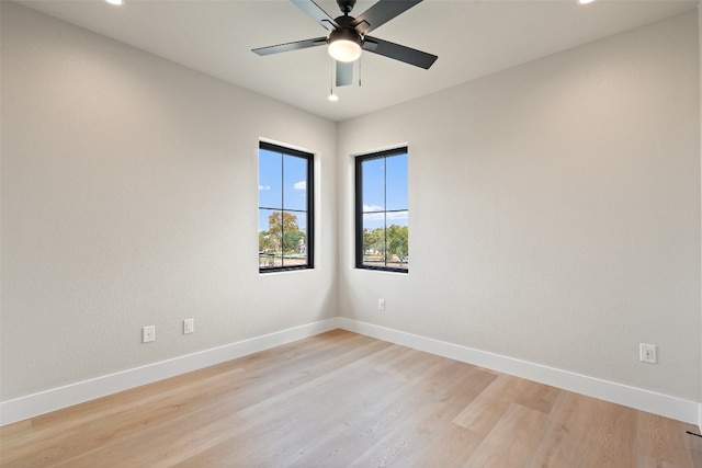 spare room featuring ceiling fan and light wood-type flooring