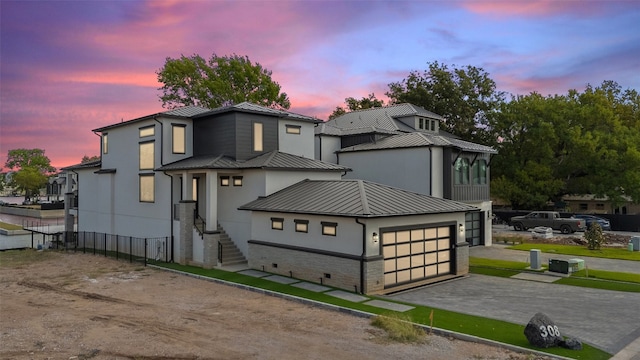 view of front of home with a garage