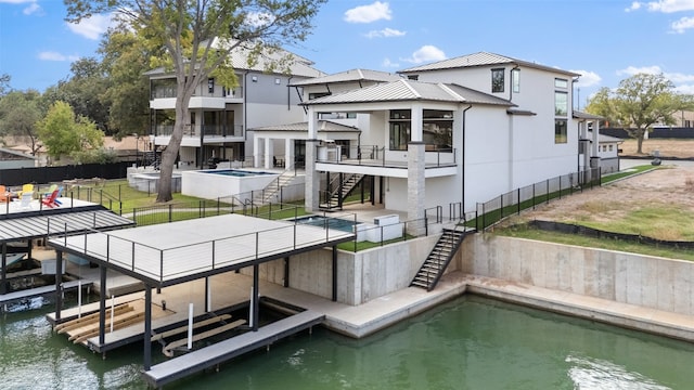 back of property with a water view