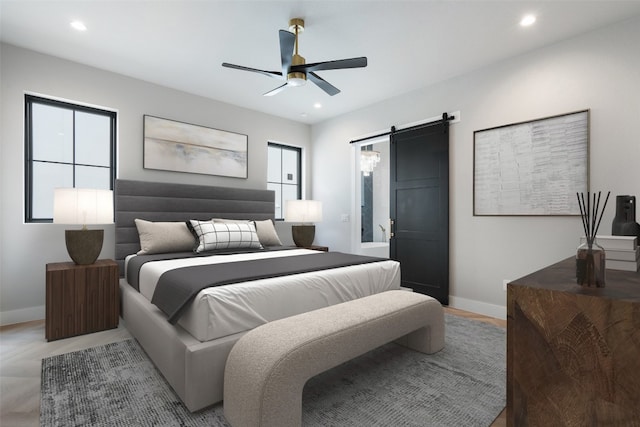 bedroom with a barn door and ceiling fan