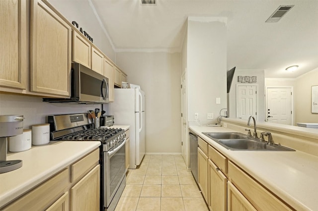 kitchen featuring appliances with stainless steel finishes, sink, light tile patterned floors, crown molding, and light brown cabinets