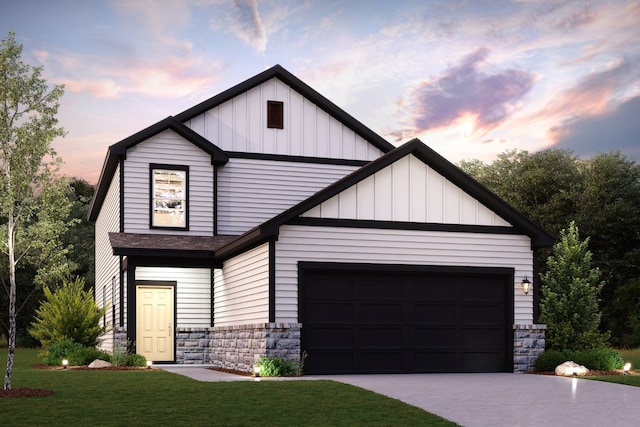 view of front of property featuring a garage and a yard