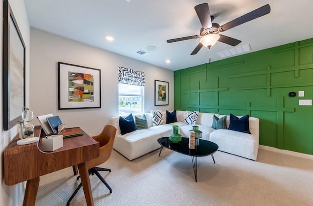 living room with ceiling fan and light carpet