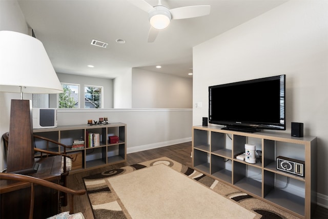 office area with dark wood-type flooring and ceiling fan