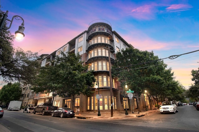 view of outdoor building at dusk