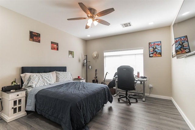 bedroom featuring dark wood-type flooring and ceiling fan