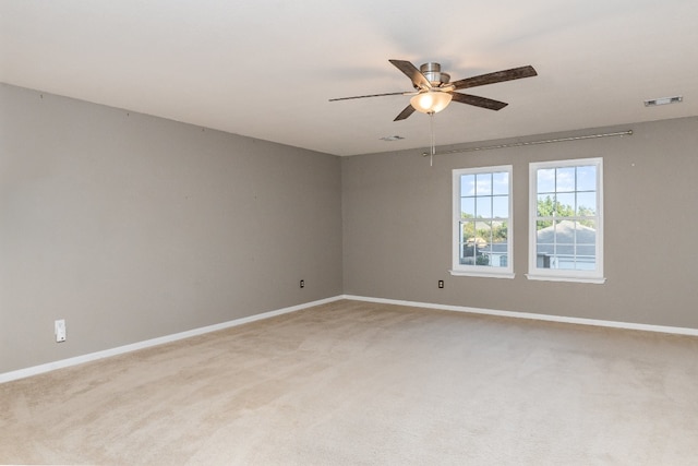 unfurnished room with carpet flooring and ceiling fan