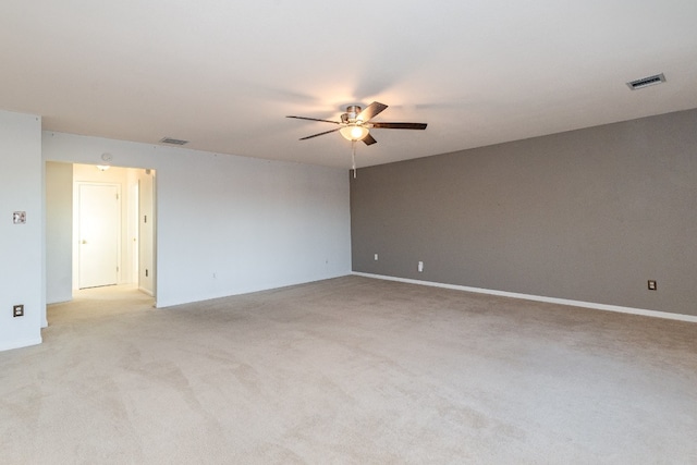 empty room with light carpet and ceiling fan