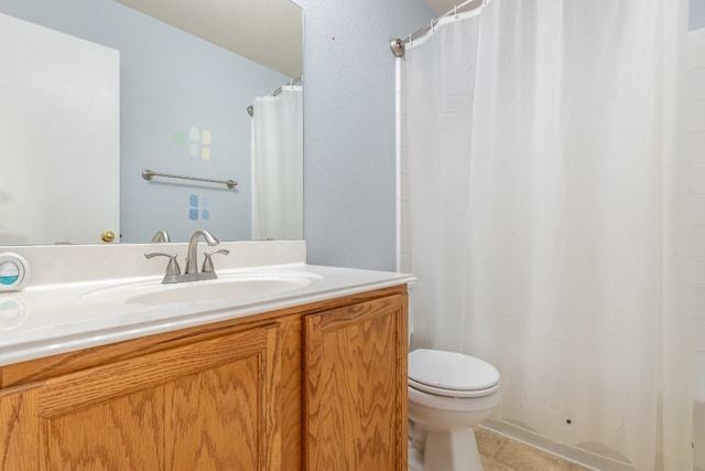 bathroom with tile patterned flooring, vanity, toilet, and a shower with curtain