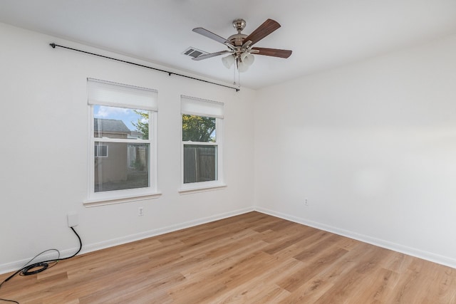 unfurnished room with ceiling fan and light hardwood / wood-style floors