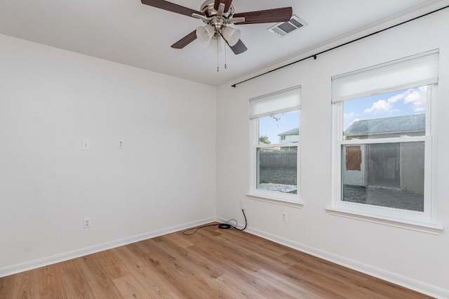 unfurnished room featuring light hardwood / wood-style flooring and ceiling fan