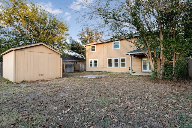 back of house with a patio