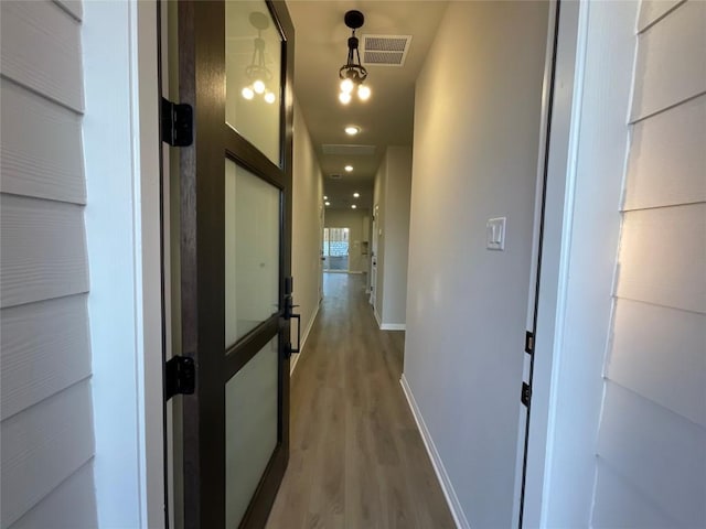 hallway featuring hardwood / wood-style flooring