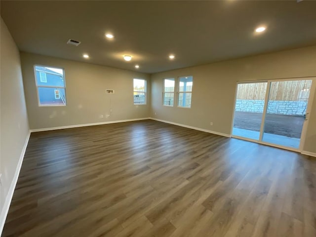 empty room featuring dark wood-type flooring