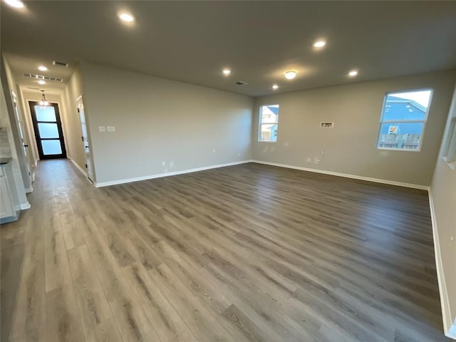 unfurnished room with hardwood / wood-style floors