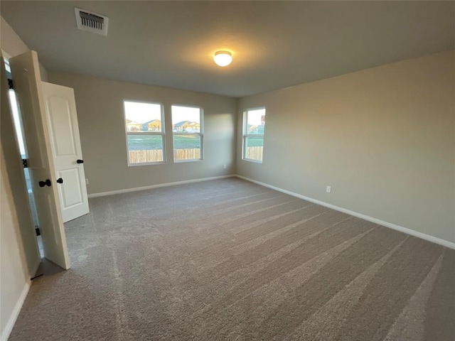 empty room featuring carpet flooring