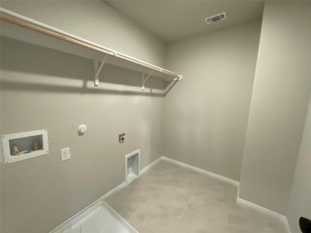 laundry room featuring hookup for an electric dryer, light tile patterned flooring, gas dryer hookup, and washer hookup