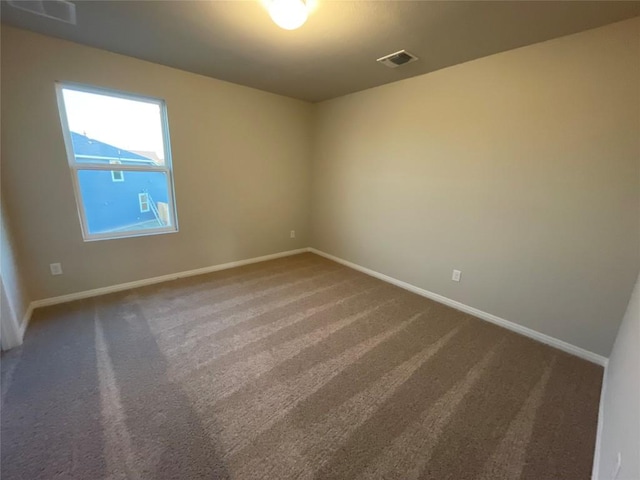 empty room featuring carpet floors