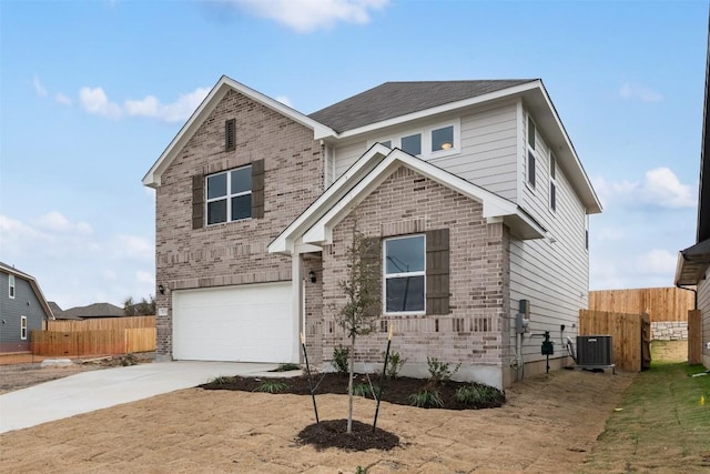 view of front of house with a garage and central AC unit