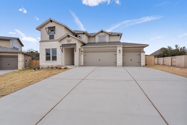 132 Scenic Hills Cir, Georgetown, TX 78628 - view of front of property with stone siding, fence, stucco siding, and concrete driveway