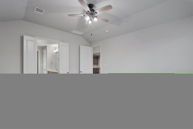 132 Scenic Hills Cir, Georgetown, TX 78628 - unfurnished bedroom featuring lofted ceiling, baseboards, ensuite bath, and a ceiling fan