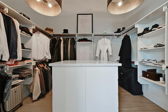 walk in closet featuring light hardwood / wood-style floors