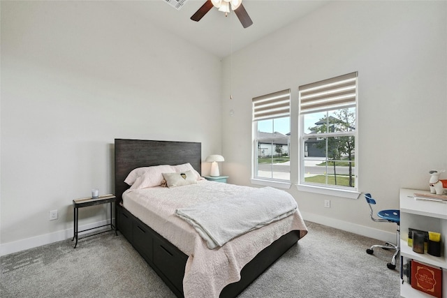 bedroom featuring ceiling fan and light carpet