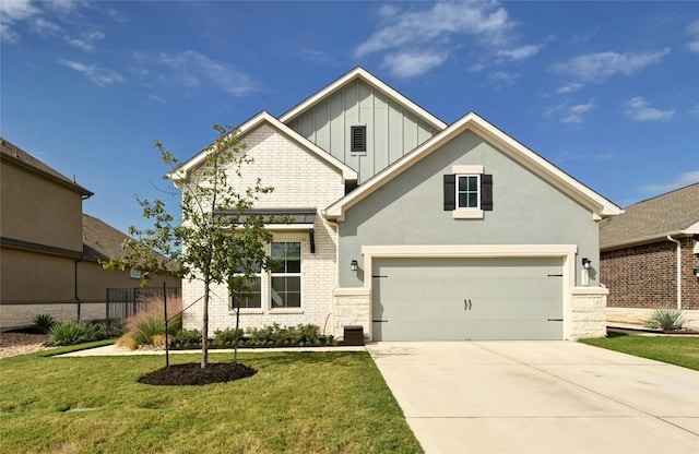 view of front of property with a front yard and a garage