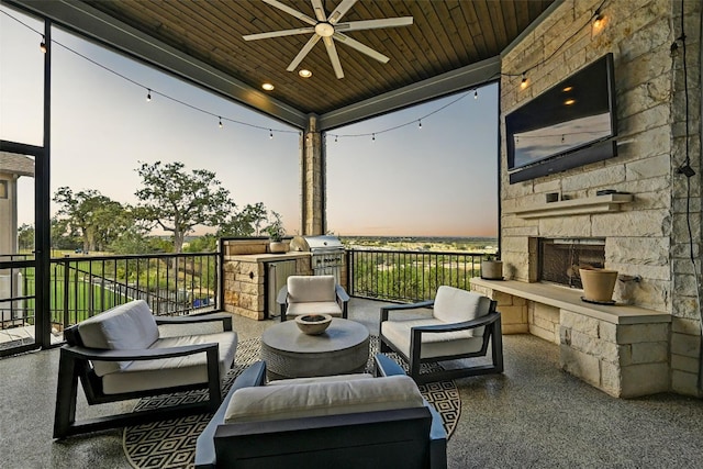 view of patio with ceiling fan, a grill, and an outdoor living space with a fireplace