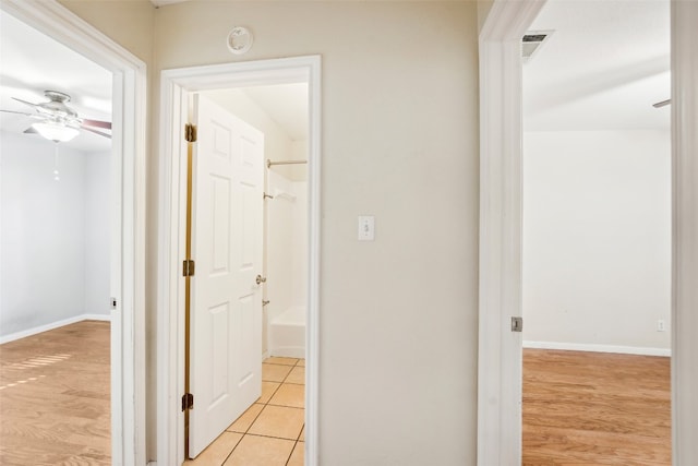 hallway with light wood-type flooring