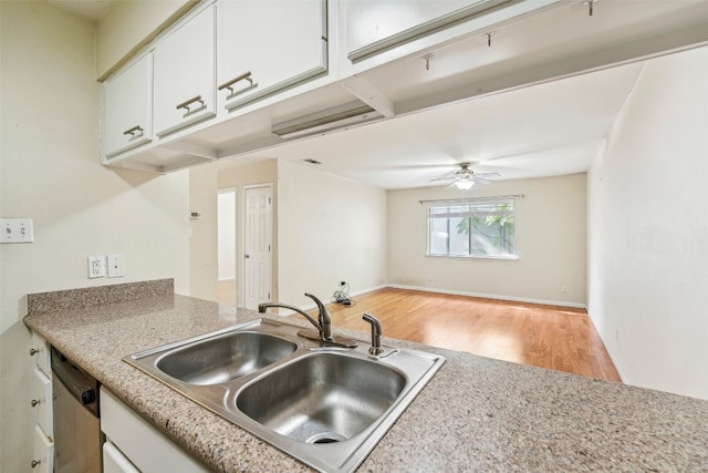 kitchen featuring sink, white cabinets, dishwasher, ceiling fan, and light hardwood / wood-style flooring