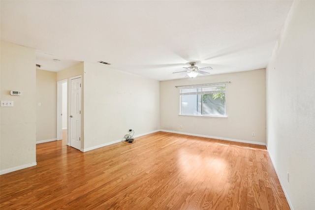 unfurnished room featuring light hardwood / wood-style flooring and ceiling fan