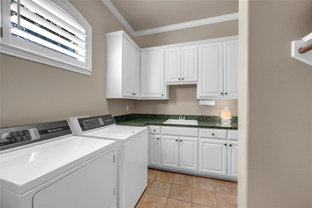 washroom with cabinets, ornamental molding, sink, and independent washer and dryer