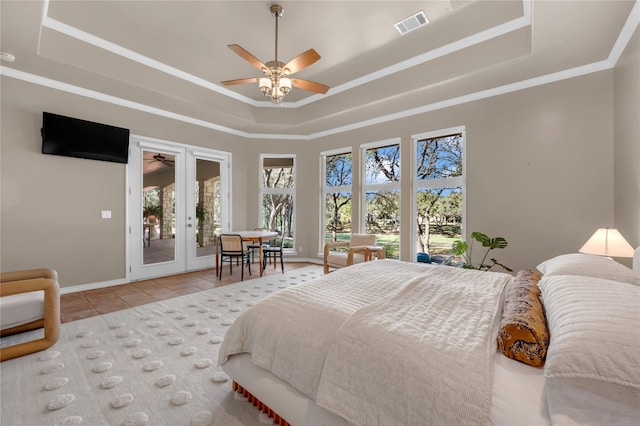 tiled bedroom with french doors, access to outside, ceiling fan, and a tray ceiling