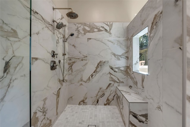 bathroom featuring tiled shower