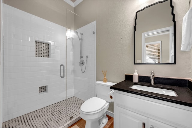 bathroom with tile patterned flooring, vanity, toilet, and an enclosed shower