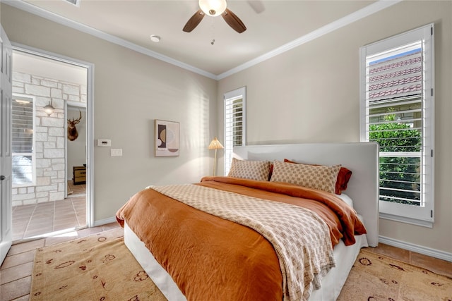 tiled bedroom featuring ornamental molding and ceiling fan