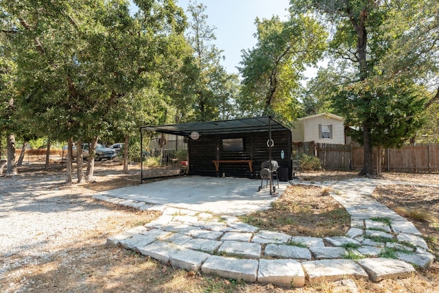 view of patio / terrace featuring a carport