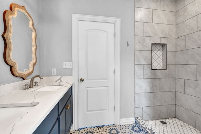 bathroom featuring vanity and a tile shower