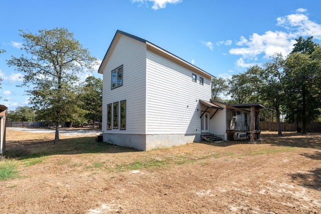 view of side of property featuring a yard