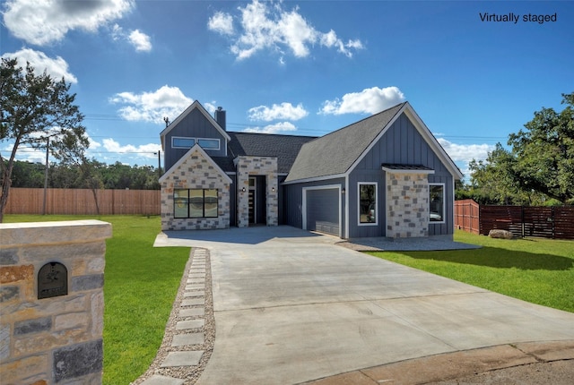 view of front of home featuring a garage and a front lawn