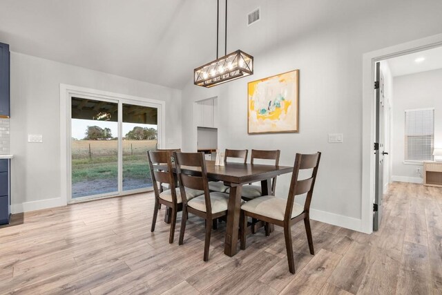 dining area featuring light wood-type flooring