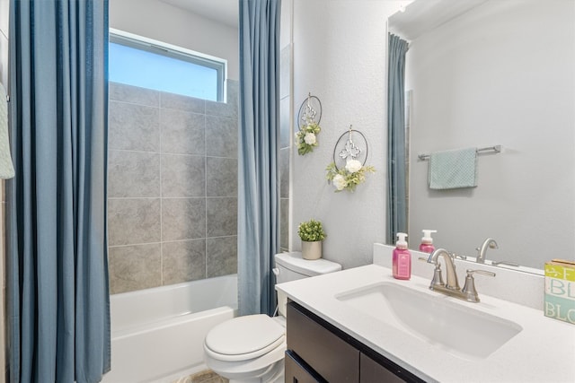 full bathroom featuring vanity, shower / bath combo, and toilet