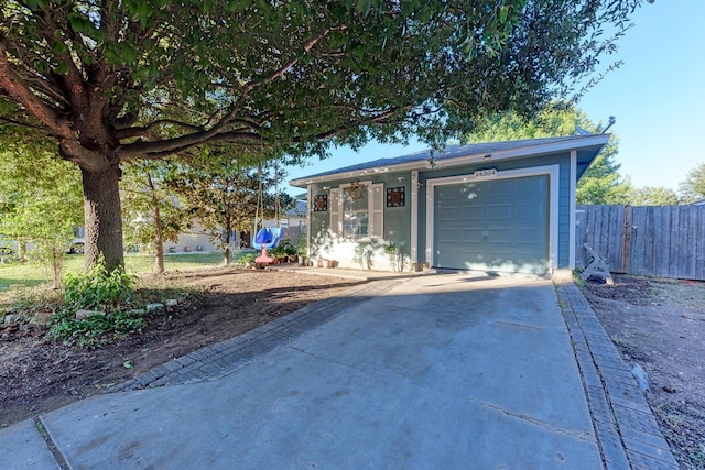 single story home featuring a garage