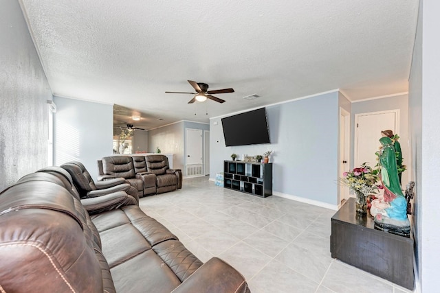 living room featuring a textured ceiling and ceiling fan