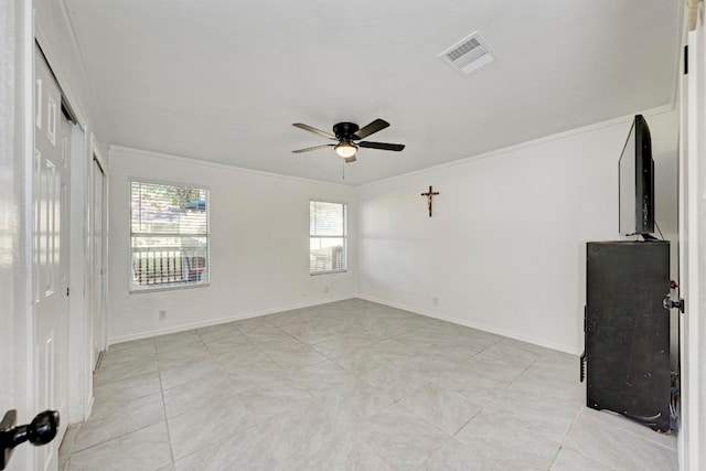 interior space with ceiling fan and ornamental molding