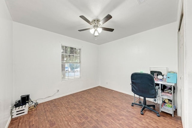 home office with ceiling fan and hardwood / wood-style flooring