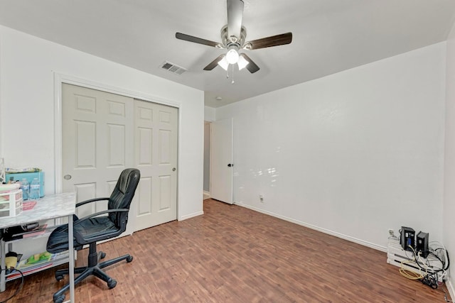 home office with hardwood / wood-style floors and ceiling fan